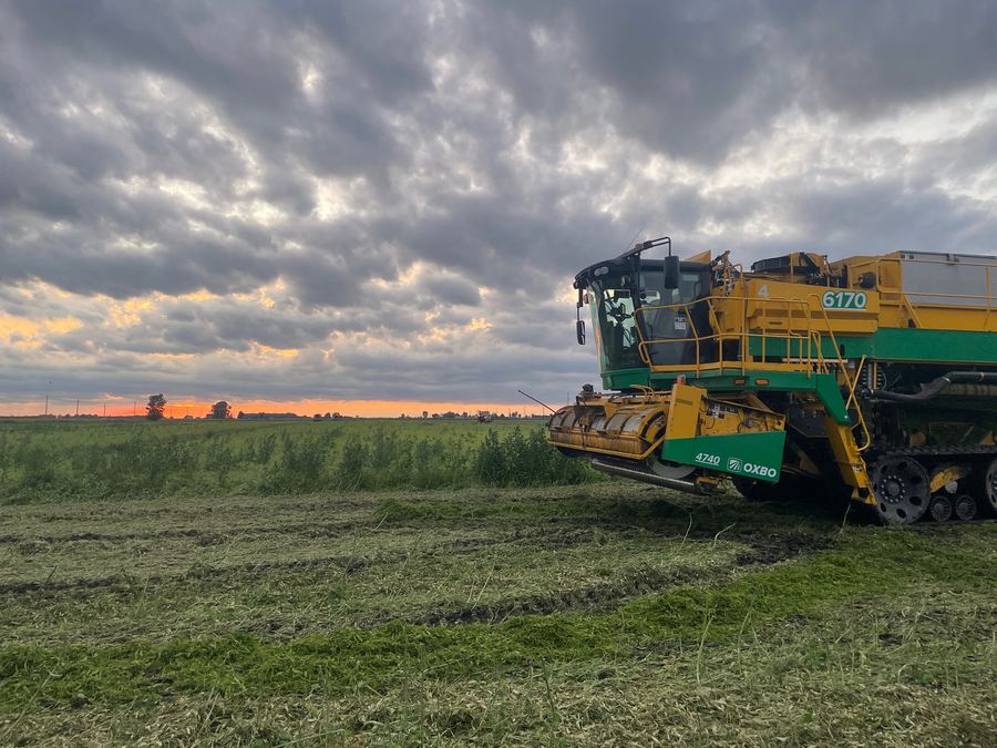 Farm equipment at sunset